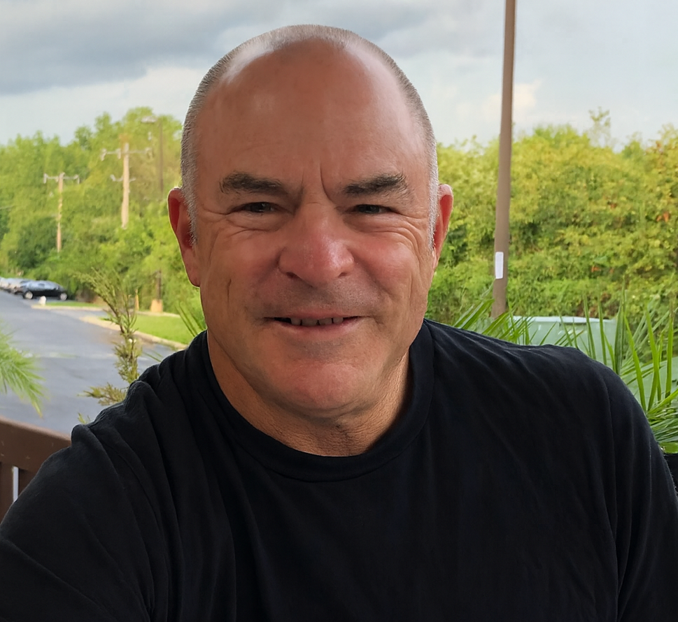 Stu Faigen smiling outdoors.